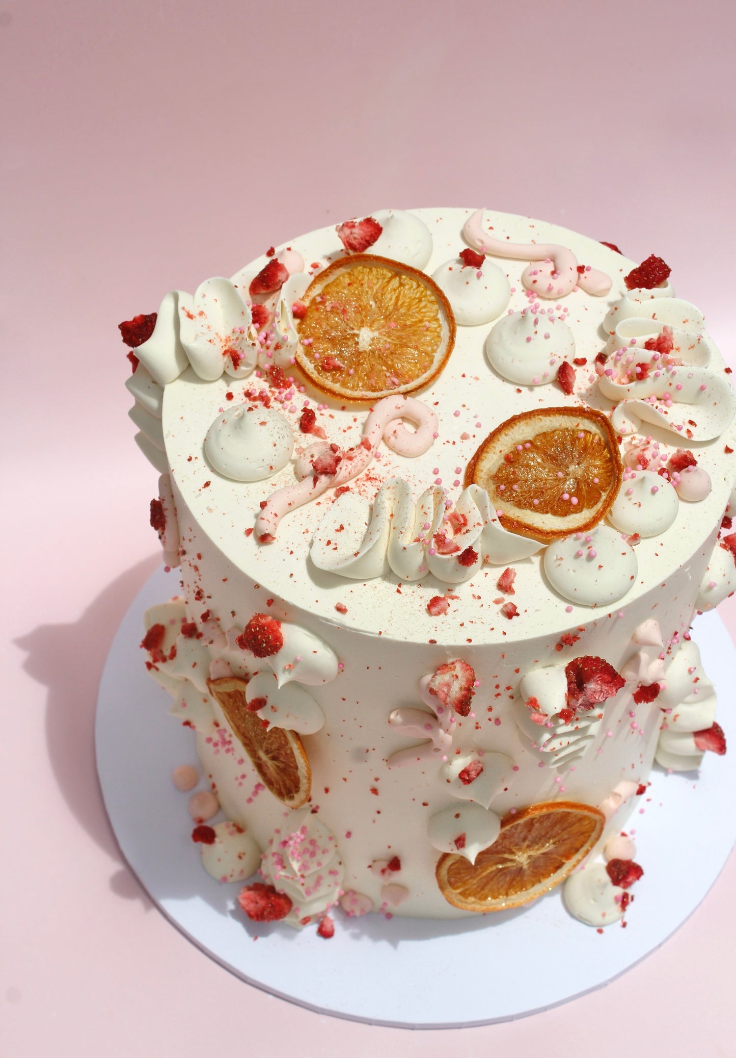 Cake by Sweet Street Cakery with dried oranges and berries