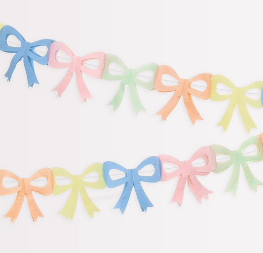 Pastel-colored bow-shaped decorations on a white background