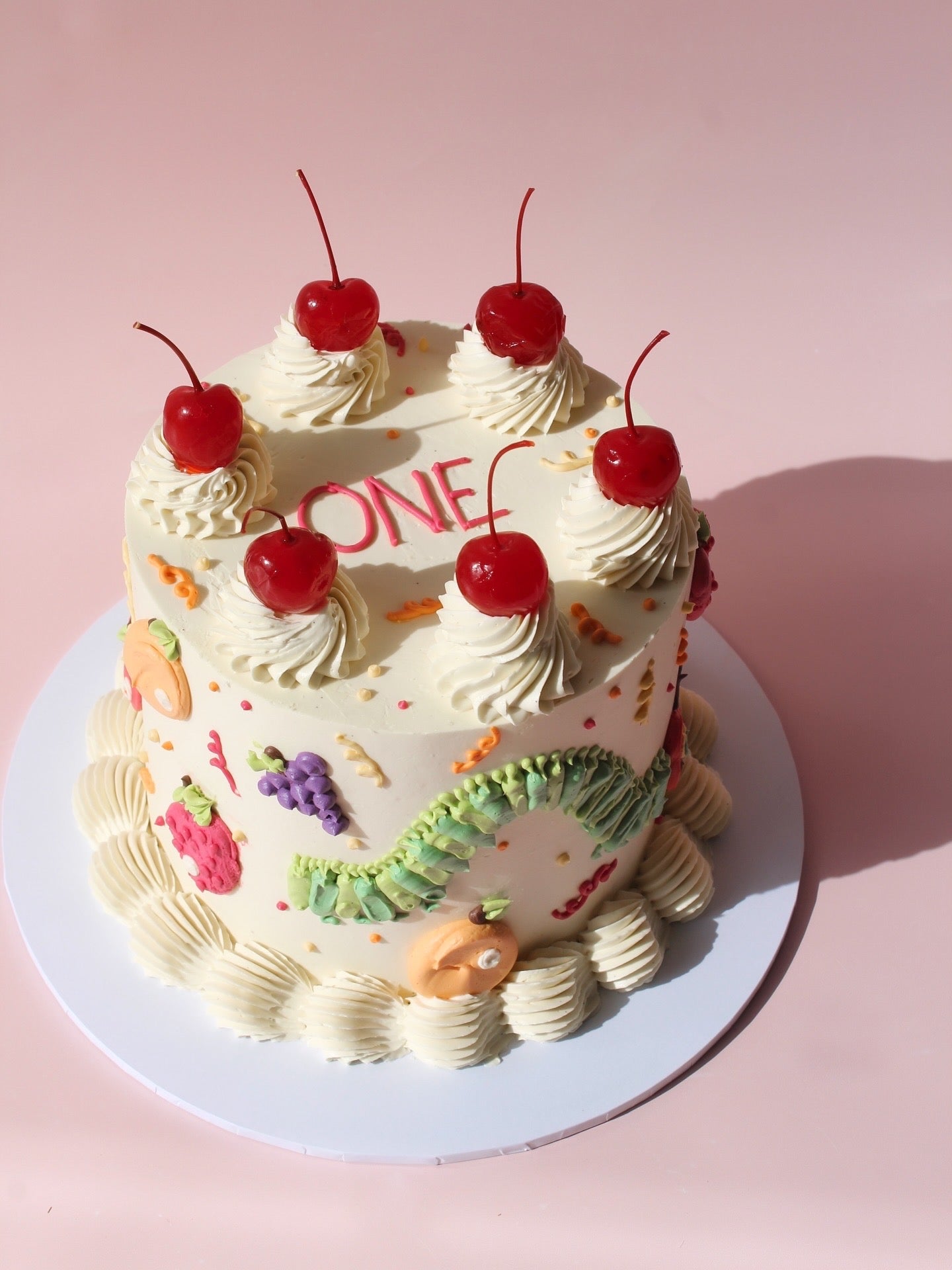Vintage style very hungry caterpillar cake 